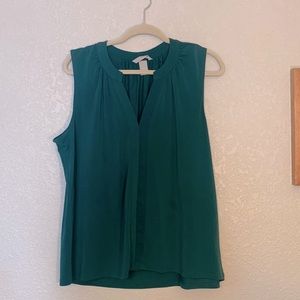 Green sleeveless blouse